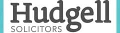 The image shows the logo of Hudgell Solicitors. The logo features the firm's name in a sleek, professional font with a unique turquoise accent, symbolizing its expertise and commitment to providing personalized legal services.