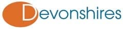 Devonshires logo, featuring an orange circle with a white ‘D’ alongside the firm name in teal lettering