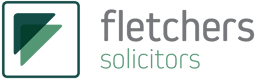 The image displays the logo of Fletchers Solicitors. The logo features the firm's name in a clean, professional font, accompanied by an abstract green symbol, reflecting its expertise and commitment to delivering high-quality legal services.