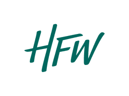 The image shows the logo of HFW, a law firm. The logo features the firm's initials "HFW" in a modern, flowing design, symbolizing professionalism and expertise in the legal industry.