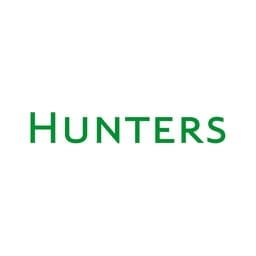 The image shows the logo of Hunters, a law firm. The logo features the firm's name "HUNTERS" in bold, green typography, symbolizing a strong and professional legal presence.